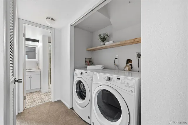 a view of storage and utility room with washer and dryer