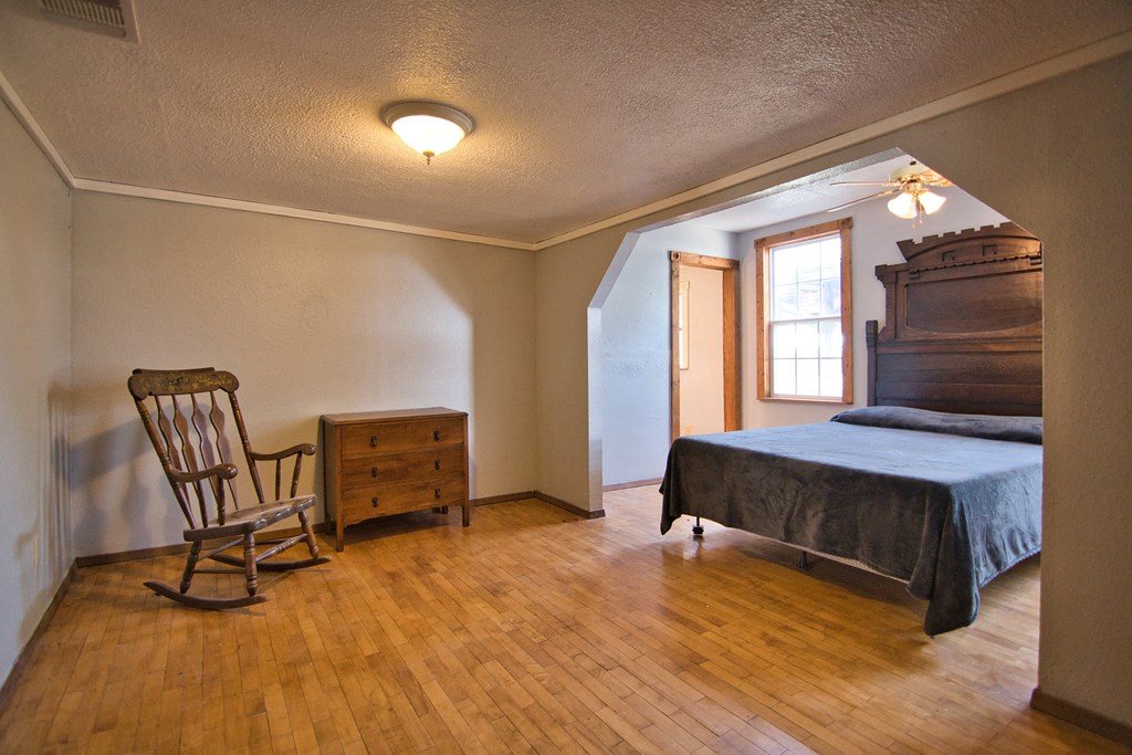 117 Robin Avenue Mason, TX 76856 - Photo 16 of 22 a bedroom with furniture and a window