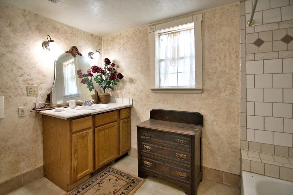 117 Robin Avenue Mason, TX 76856 - Photo 20 of 22 a bathroom with a sink and a mirror