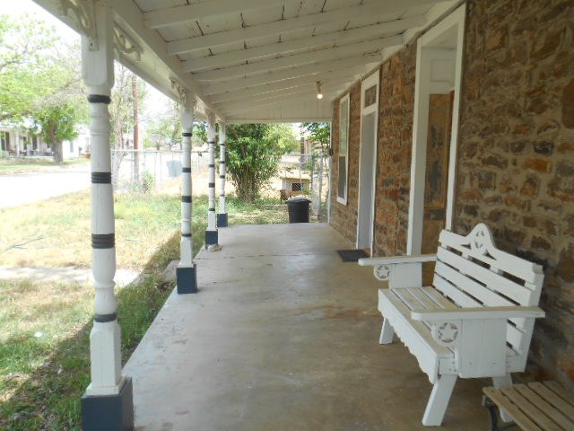 117 Robin Avenue Mason, TX 76856 - Photo 2 of 22 a view of a patio with table and chairs and potted plants