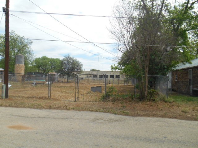 117 Robin Avenue Mason, TX 76856 - Photo 6 of 22 a backyard of a house with lots of green space