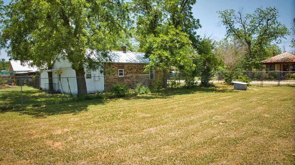 117 Robin Avenue Mason, TX 76856 - Photo 8 of 22 a backyard of a house with yard and outdoor seating