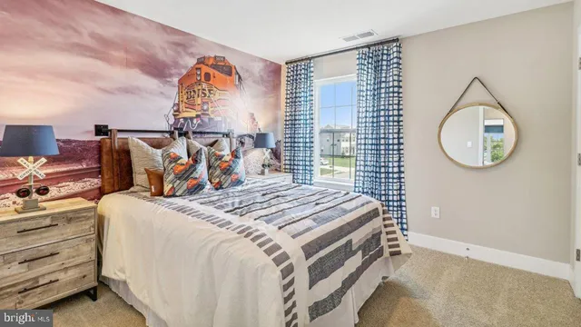 a bed room with a bed and a window