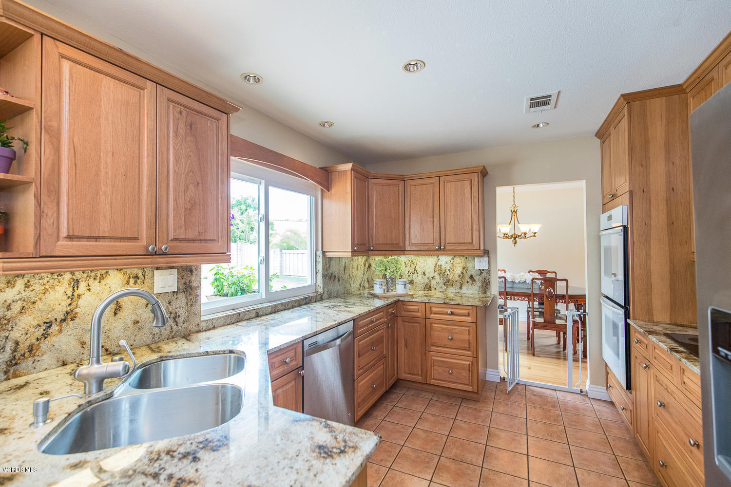 3544 Radcliffe Road Thousand Oaks, CA 91360 - Photo 3 of 27 a kitchen with a sink stove and cabinets
