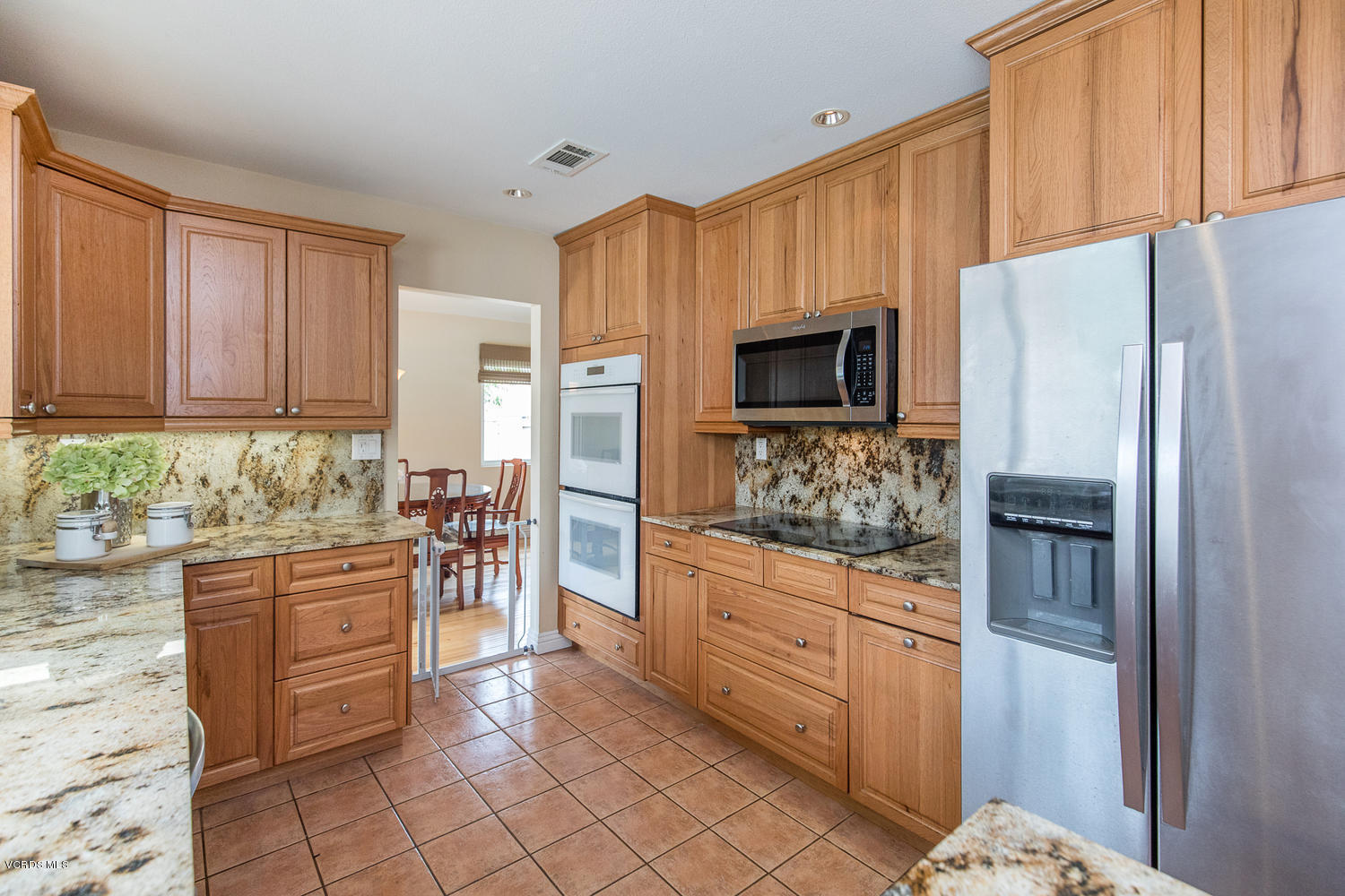 3544 Radcliffe Road Thousand Oaks, CA 91360 - Photo 4 of 27 a kitchen with stainless steel appliances granite countertop a refrigerator and a stove top oven