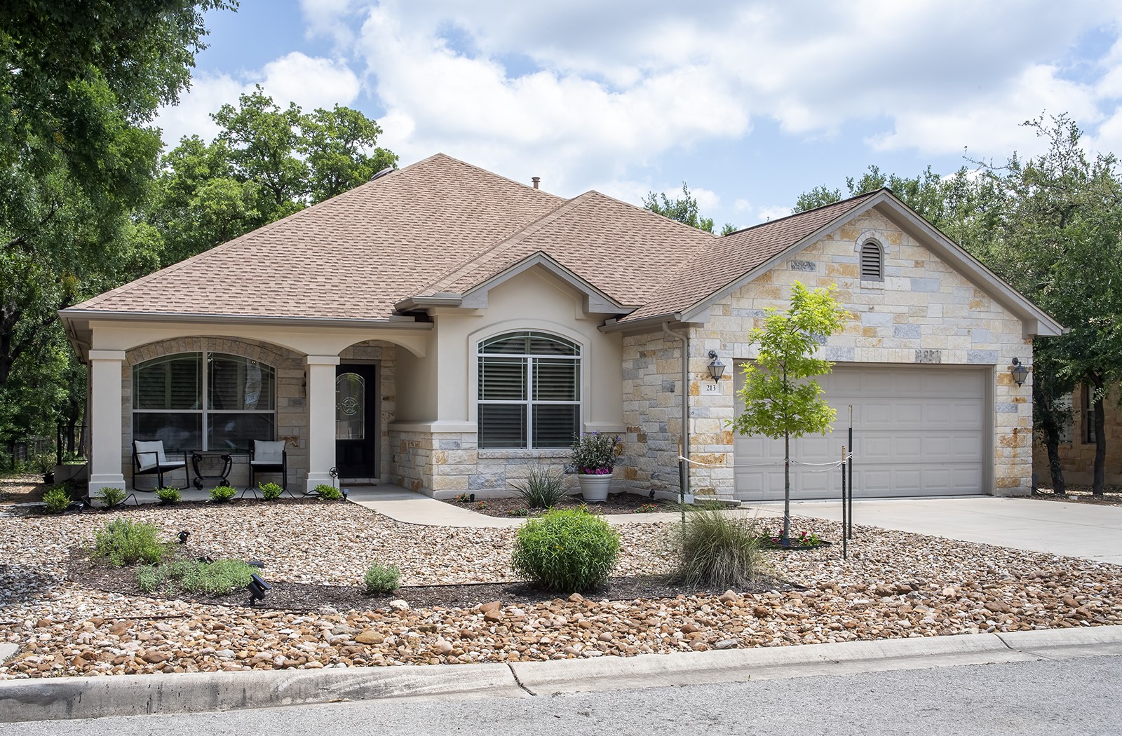 213 Acker Road Georgetown, TX 78633 - Photo 1 of 32 a front view of a house with a yard and garage