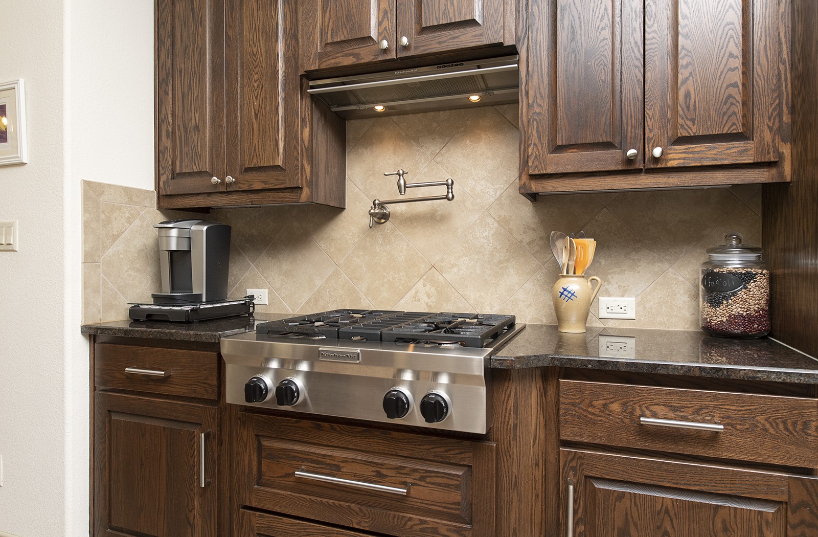 213 Acker Road Georgetown, TX 78633 - Photo 12 of 32 a kitchen with granite countertop cabinets and stove top oven