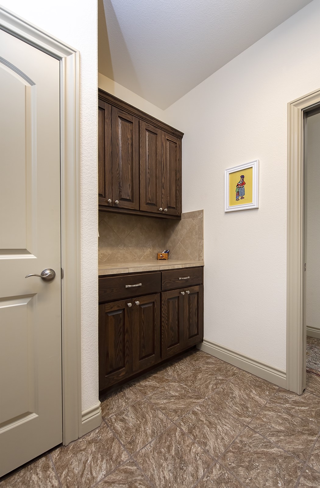 213 Acker Road Georgetown, TX 78633 - Photo 13 of 32 a kitchen with a refrigerator and cabinets