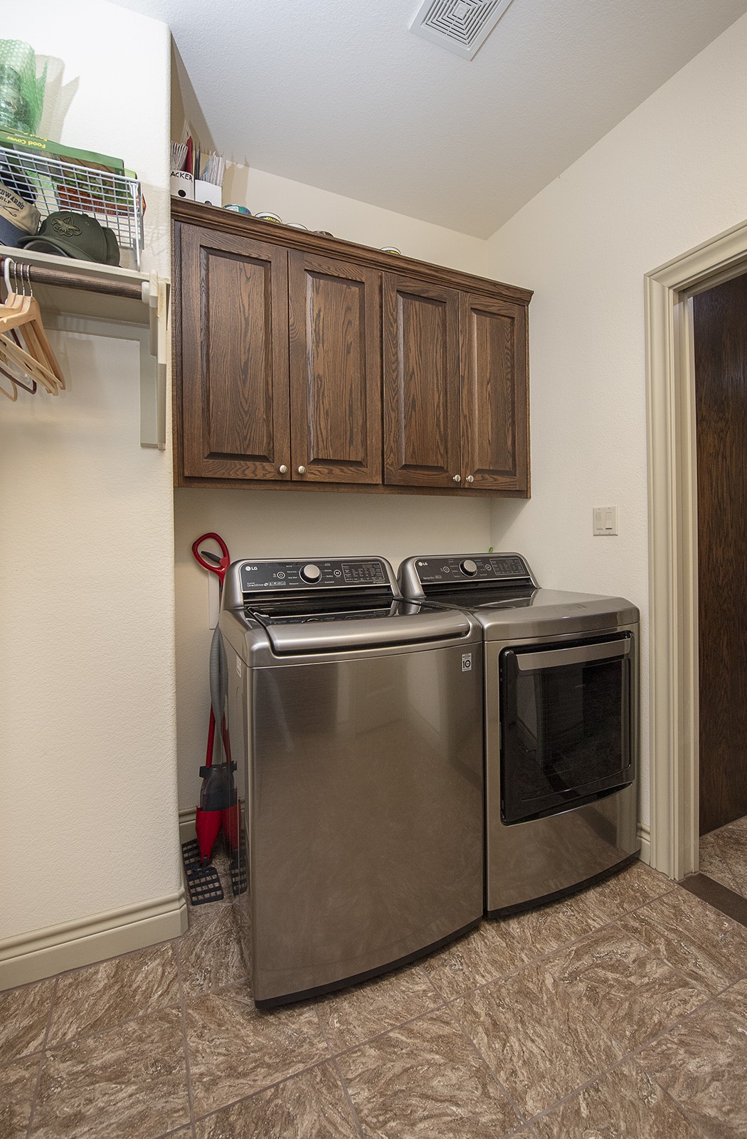 213 Acker Road Georgetown, TX 78633 - Photo 14 of 32 a view of a kitchen with stainless steel appliances granite countertop a stove and a refrigerator