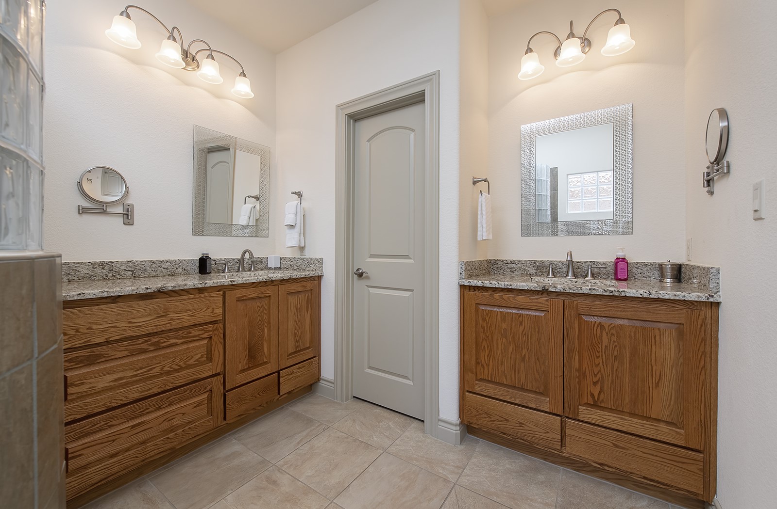 213 Acker Road Georgetown, TX 78633 - Photo 18 of 32 a bathroom with a granite countertop sink and a mirror