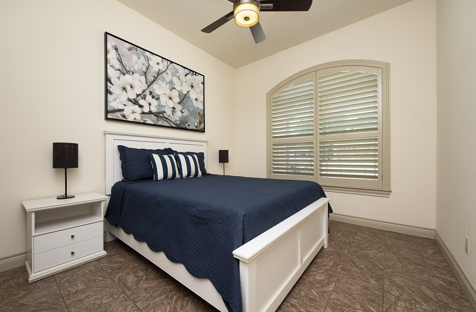213 Acker Road Georgetown, TX 78633 - Photo 22 of 32 a spacious bedroom with a bed and a painting on the wall