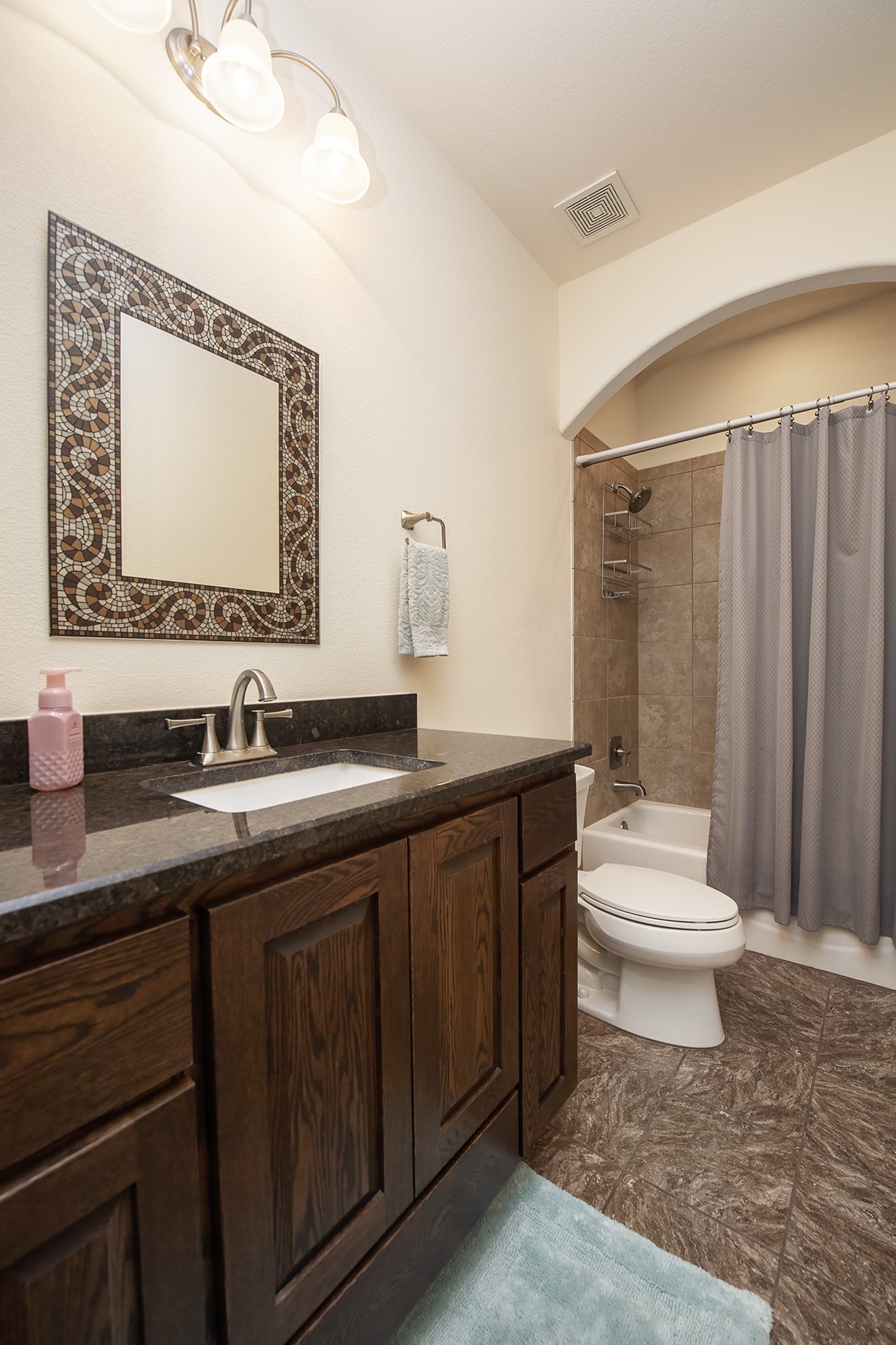 213 Acker Road Georgetown, TX 78633 - Photo 24 of 32 a bathroom with a sink a toilet and mirror