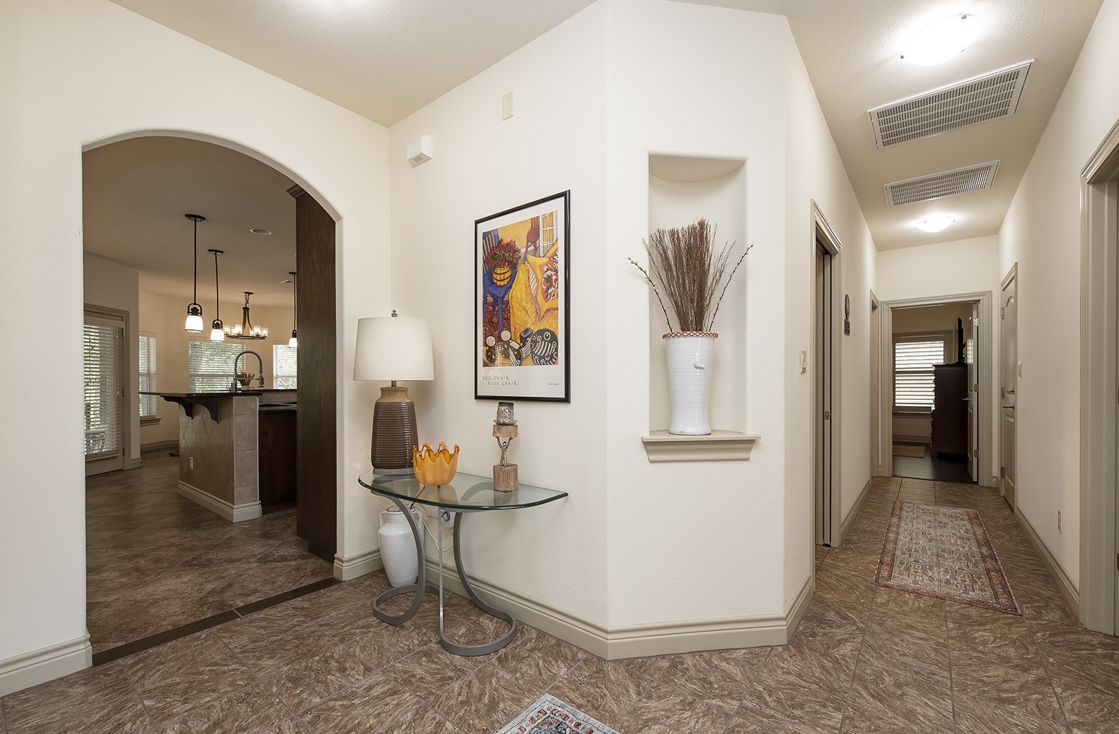 213 Acker Road Georgetown, TX 78633 - Photo 3 of 32 a view of a hallway with dining area and chandelier