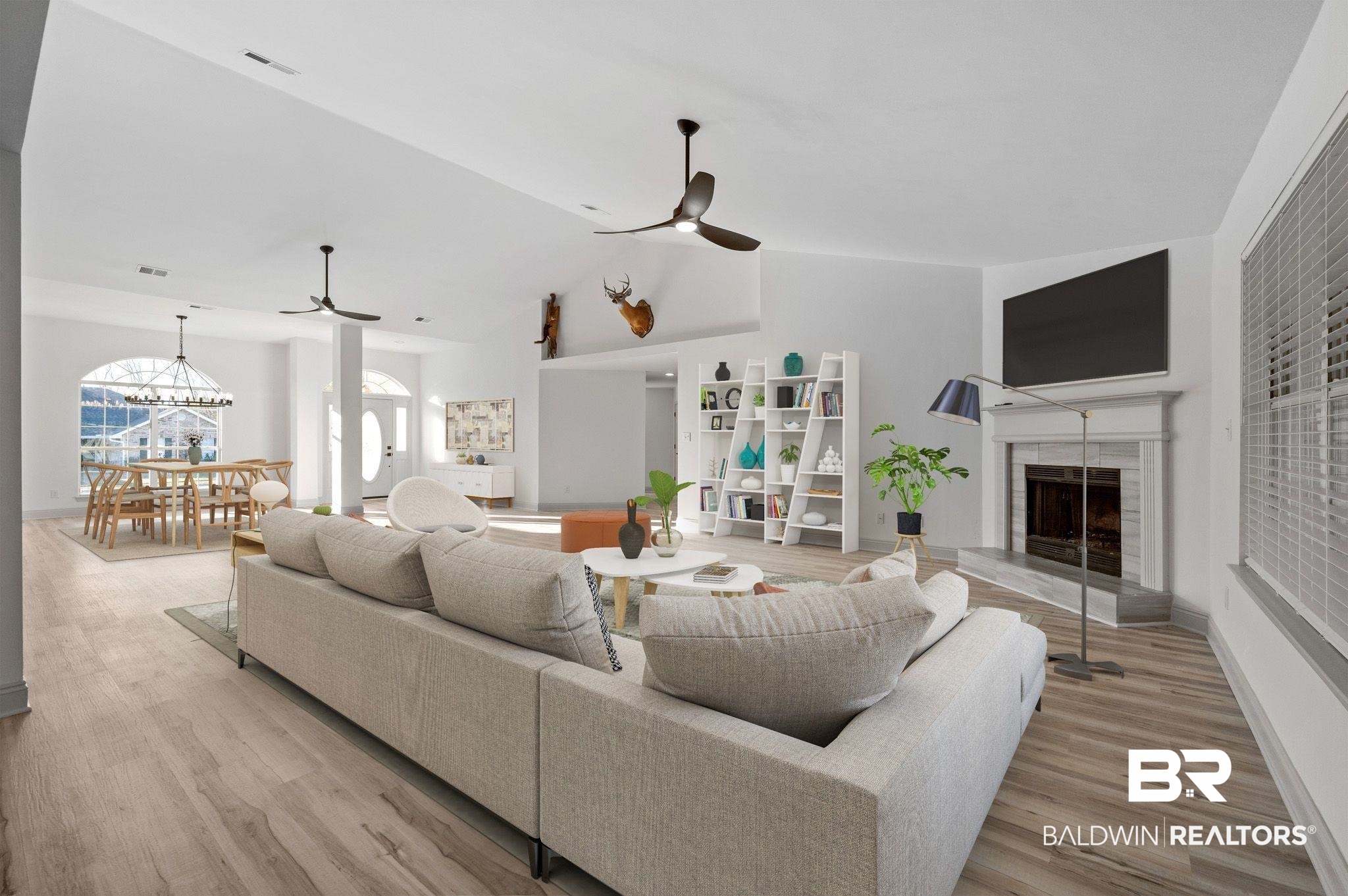 136 Destrehan Road Fairhope, AL 36532 - Photo 42 of 44 Living room featuring light hardwood / wood-style flooring, a tiled fireplace, and ceiling fan