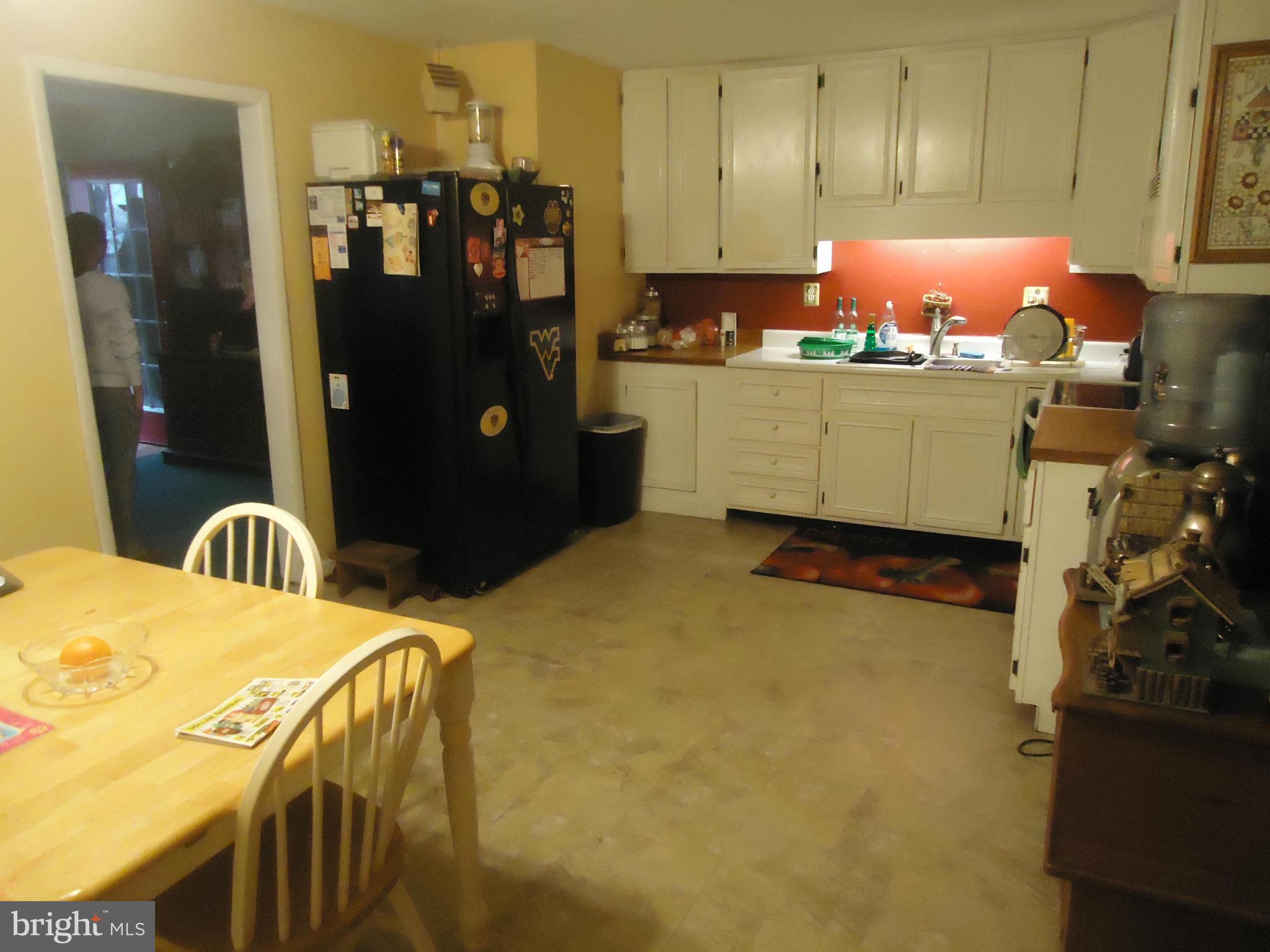 161 Orchard Drive Ranson, WV 25438 - Photo 3 of 9 a kitchen with a sink and refrigerator