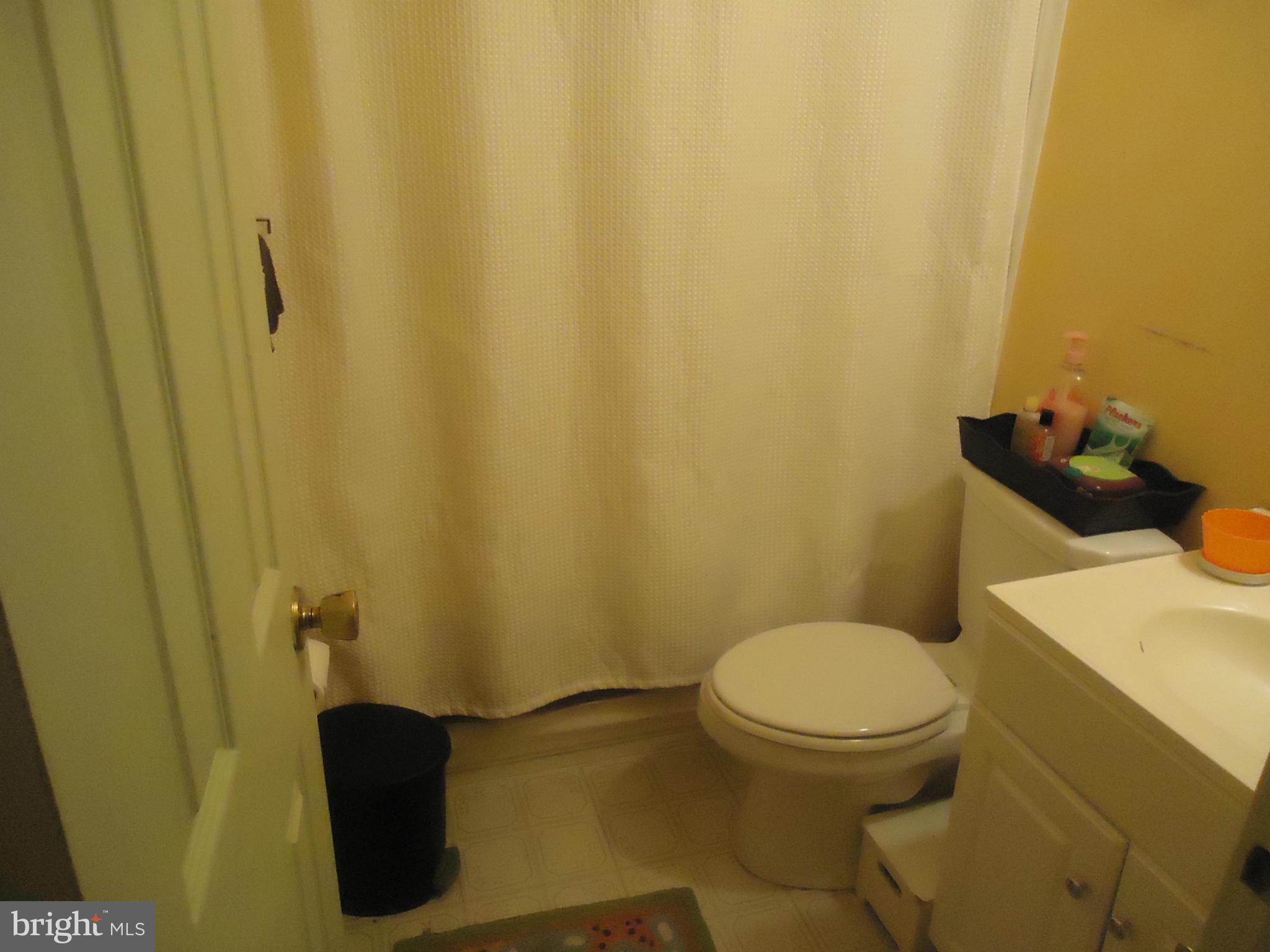 161 Orchard Drive Ranson, WV 25438 - Photo 9 of 9 a white toilet sitting next to a small sink