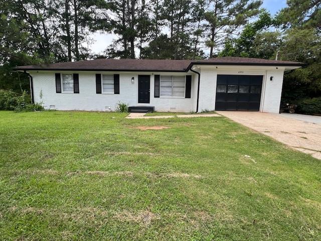 6935 Fielder Road Rex, GA 30273 - Photo 1 of 22 a front view of a house with garden