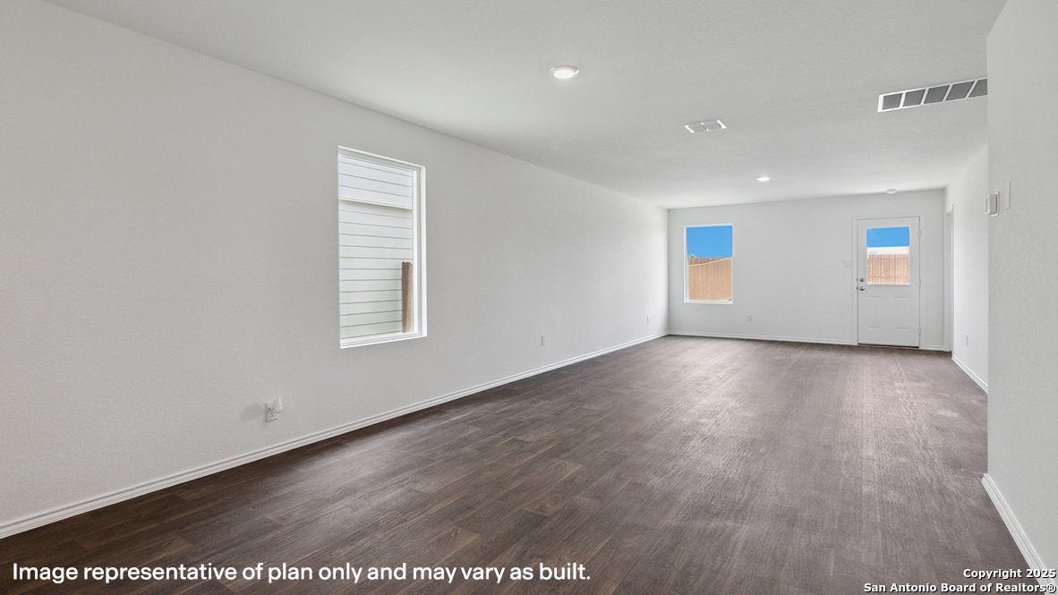 12707 Burro Canyon Converse, TX 78109 - Photo 14 of 72 an empty room with wooden floor and windows