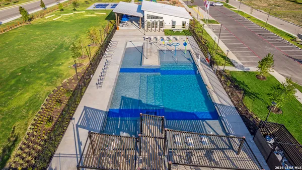 a view of dining area with chairs and table under an umbrella