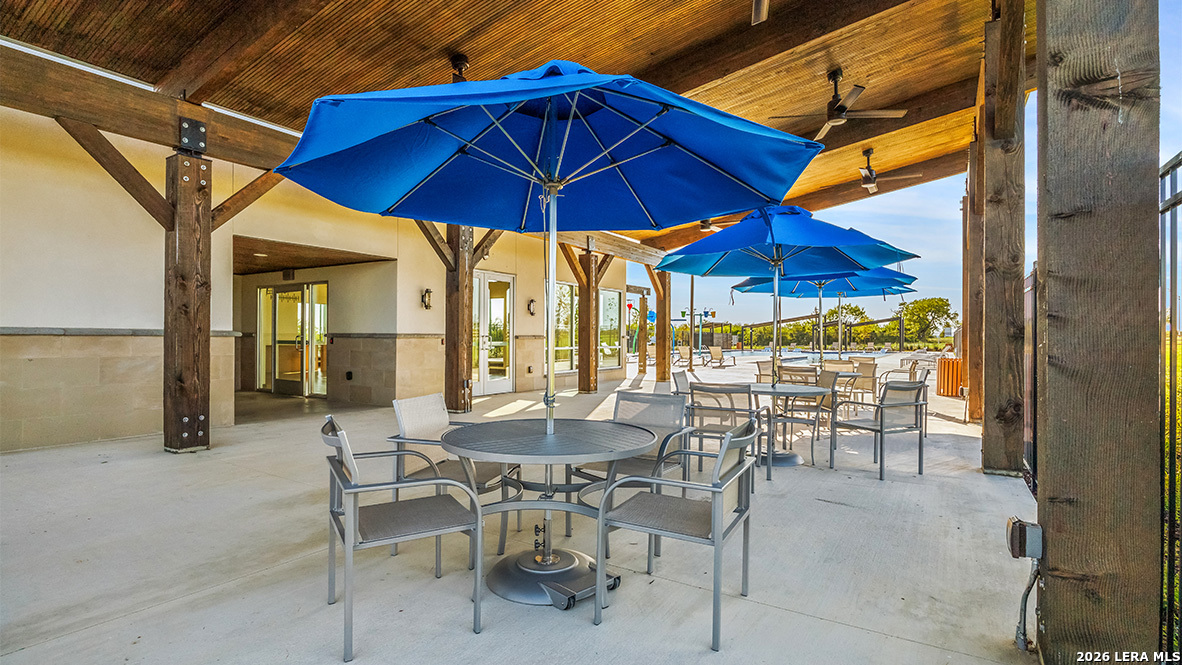 12707 Burro Canyon Converse, TX 78109 - Photo 64 of 72 a view of dining area with chairs and table under an umbrella