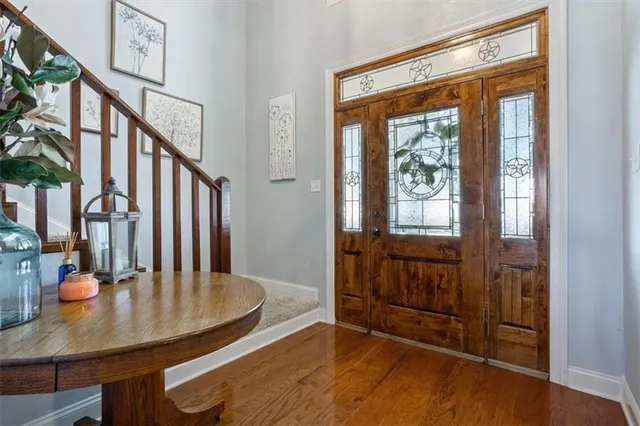 a view of a livingroom with furniture window and wooden floor