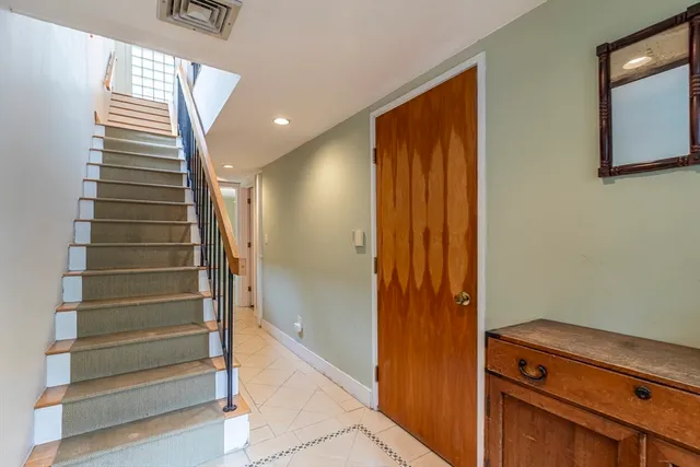 a view of entryway with stairs and a window