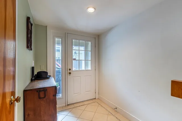 a view of an entryway with wooden floor