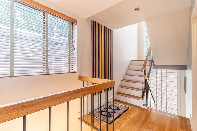 a front view of a house with wooden floor and windows