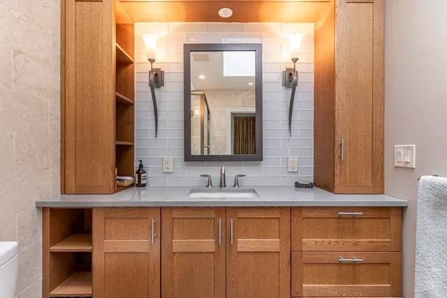 a bathroom with a sink and a mirror