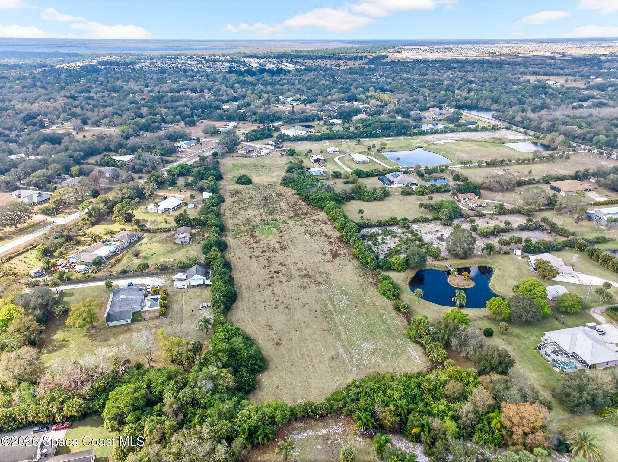3825 Turtle Mound Road Melbourne, FL 32934 - Photo 6 of 19 an aerial view of a house with a yard
