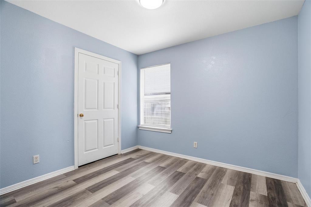 609 Race Street Crowley, TX 76036 - Photo 11 of 18 a view of an empty room with a window