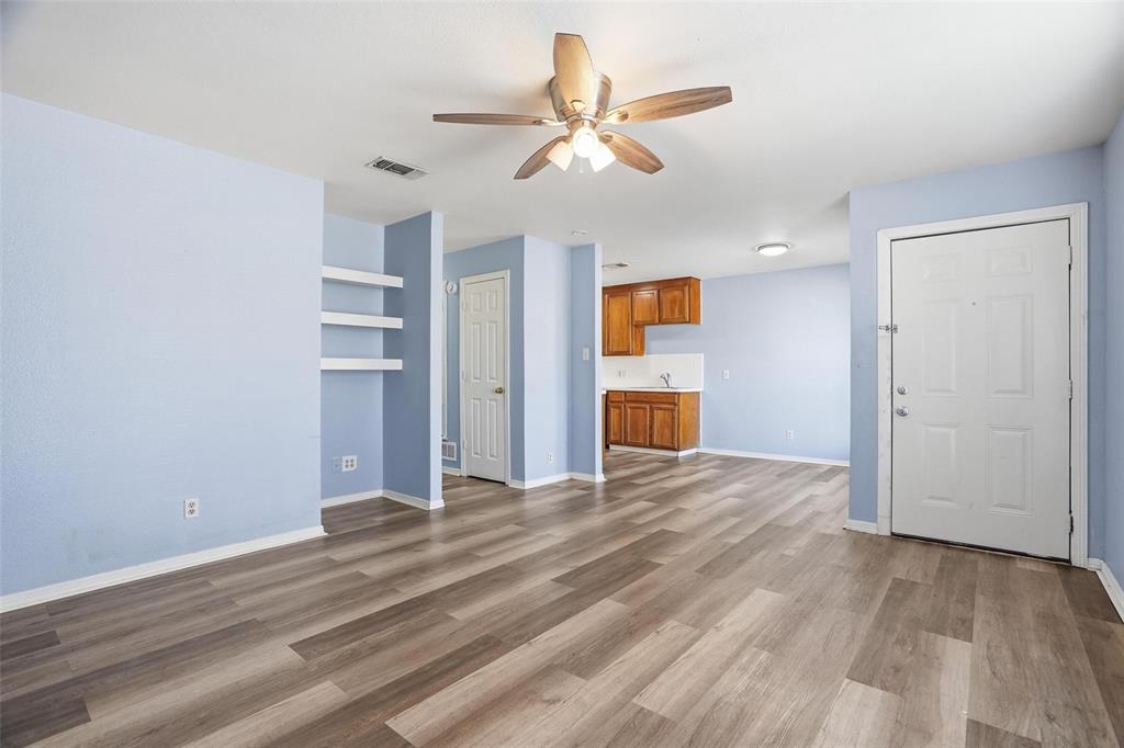 609 Race Street Crowley, TX 76036 - Photo 2 of 18 wooden floor in an empty room with a window