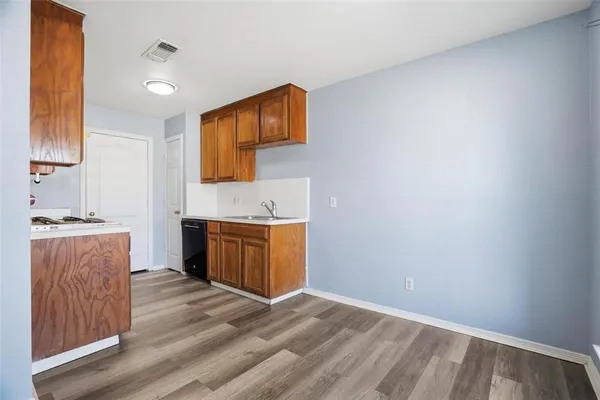 a bathroom with a sink vanity and a mirror