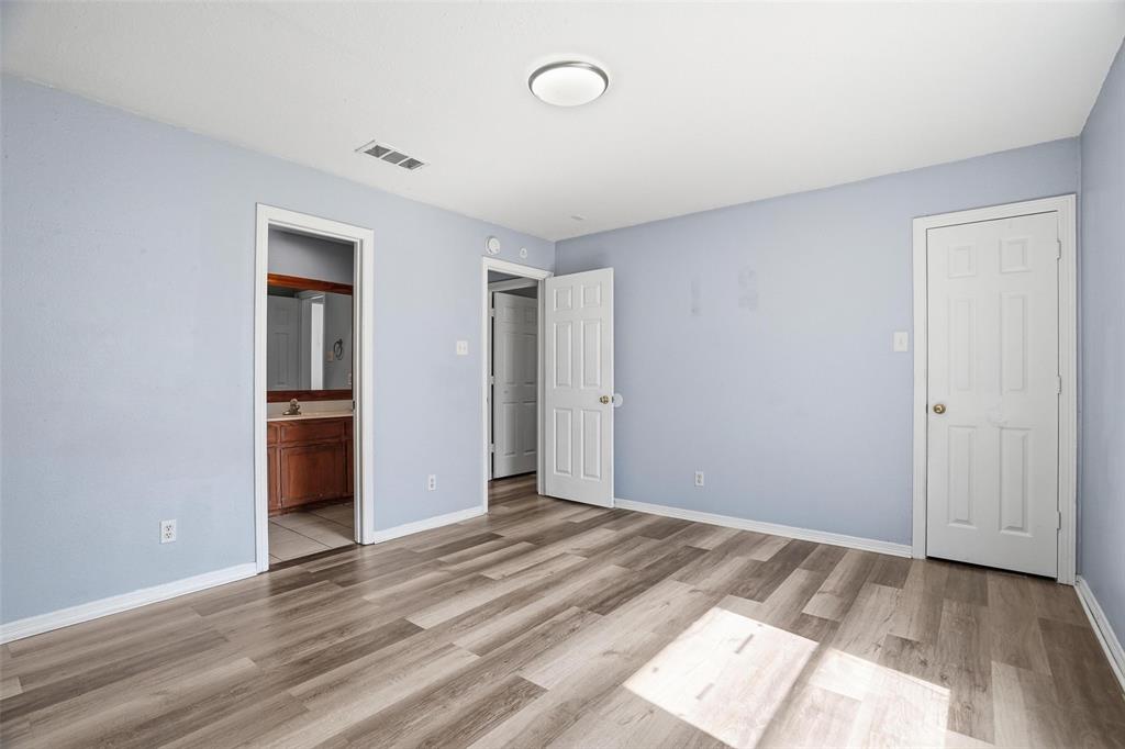 609 Race Street Crowley, TX 76036 - Photo 9 of 18 a view of a room with wooden floor and a sink