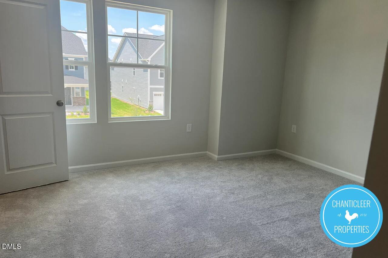 5549 Mill Dam Road Wake Forest, NC 27587 - Photo 12 of 16 an empty room with windows