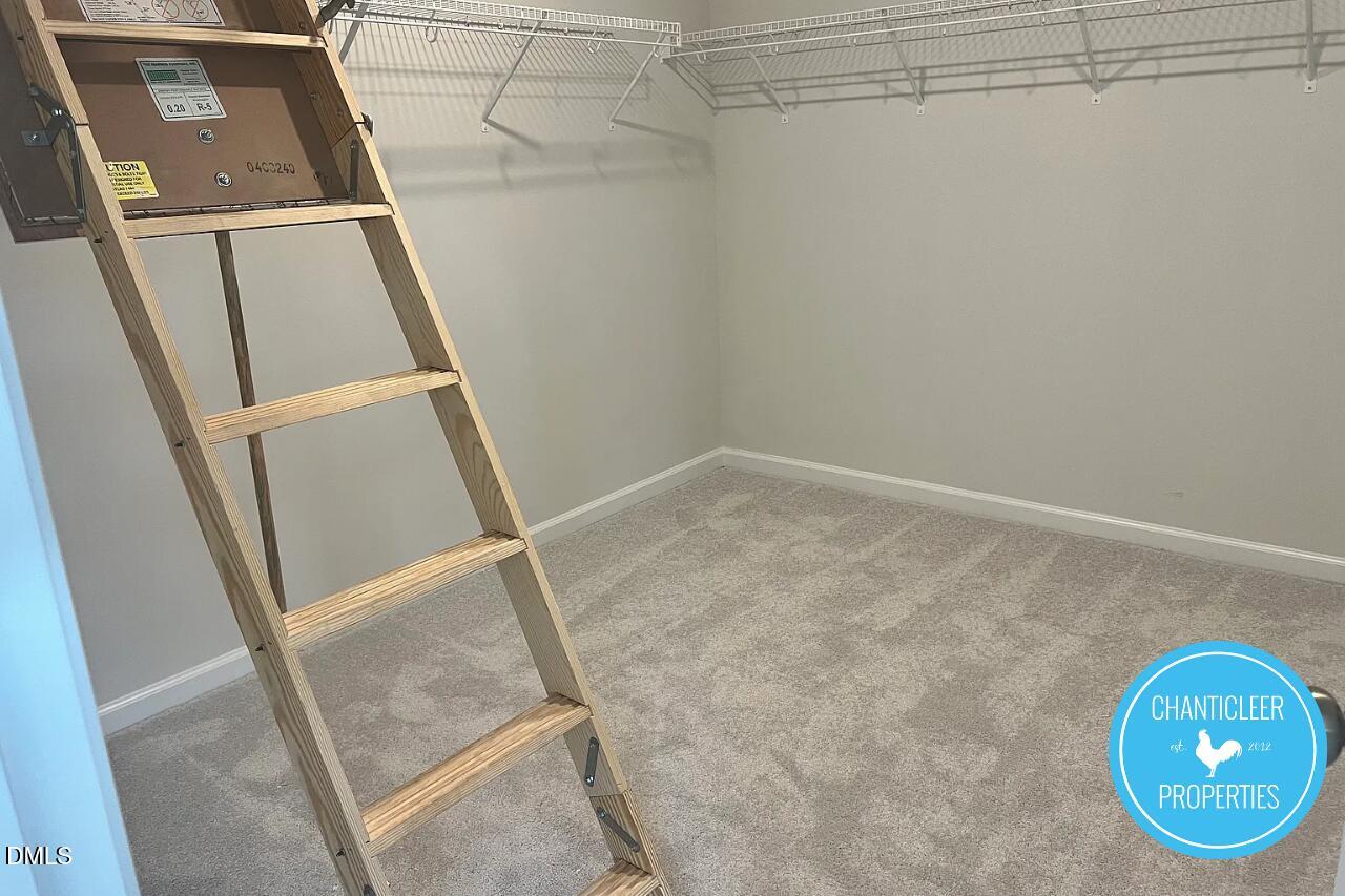 5549 Mill Dam Road Wake Forest, NC 27587 - Photo 15 of 16 view of an empty room with wooden floor and mirror