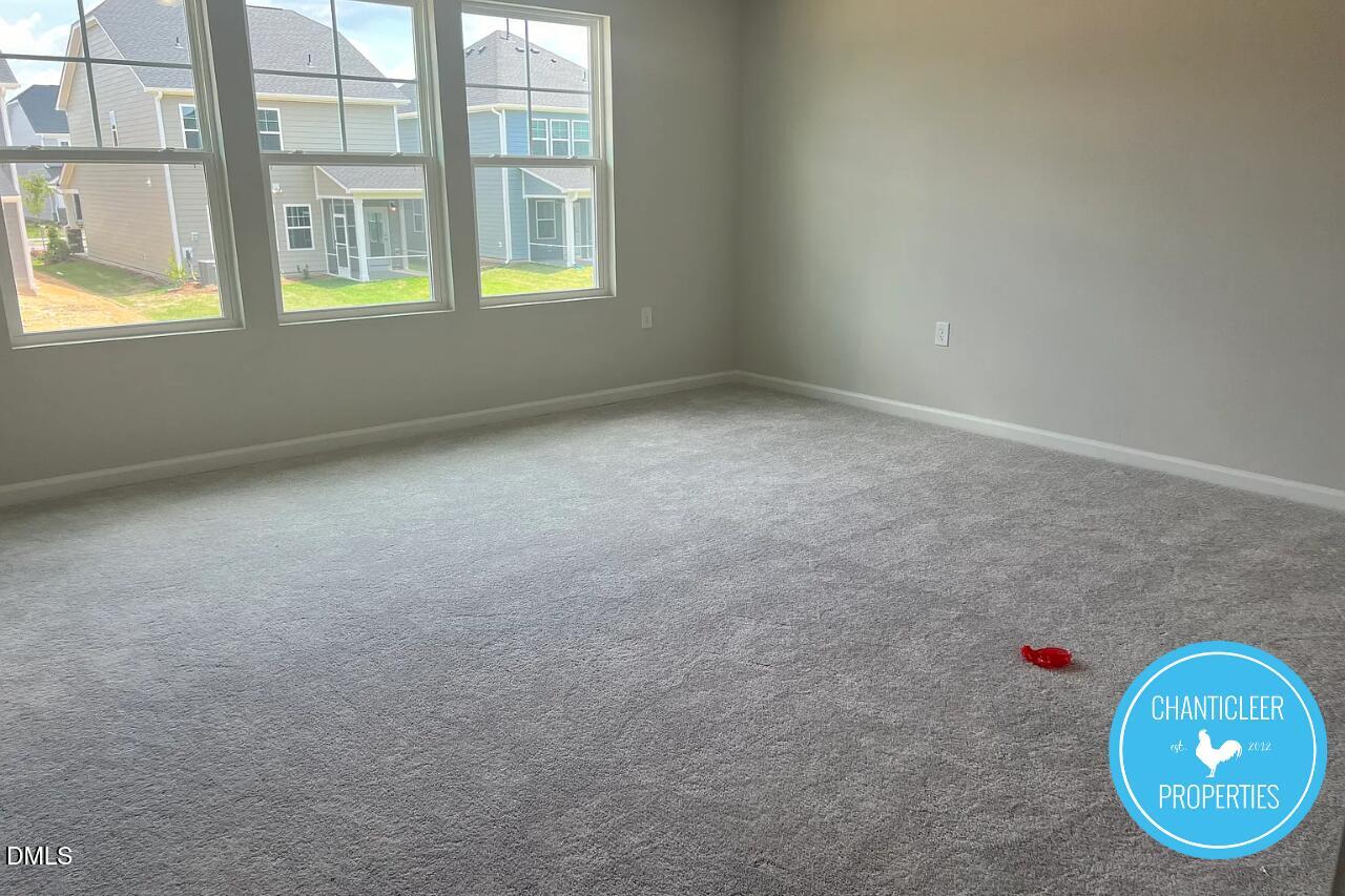 5549 Mill Dam Road Wake Forest, NC 27587 - Photo 9 of 16 an empty room with windows