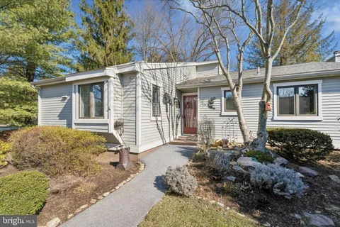 front view of a house with a trees