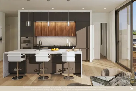 a kitchen with a sink cabinets and window