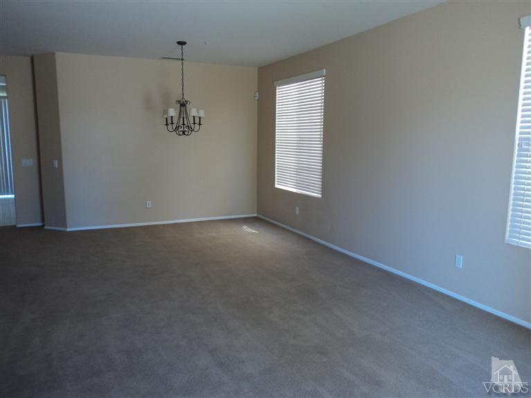 1113 Unidad Way Oxnard, CA 93030 - Photo 2 of 5 an empty room with a empty space and windows