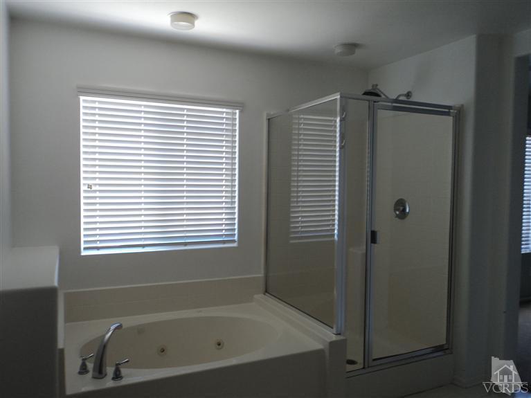 1113 Unidad Way Oxnard, CA 93030 - Photo 5 of 5 a bathroom with a bathtub and a shower