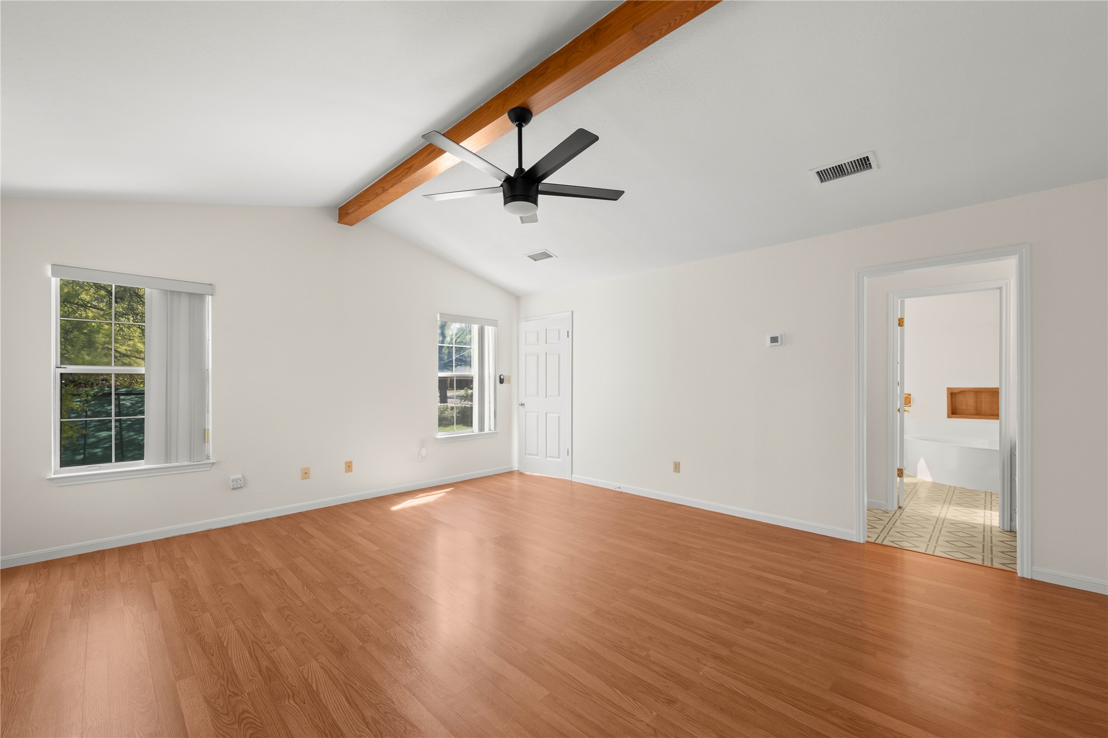 986 Benchmark Trail Belton, TX 76513 - Photo 13 of 31 wooden floor in an empty room with a window