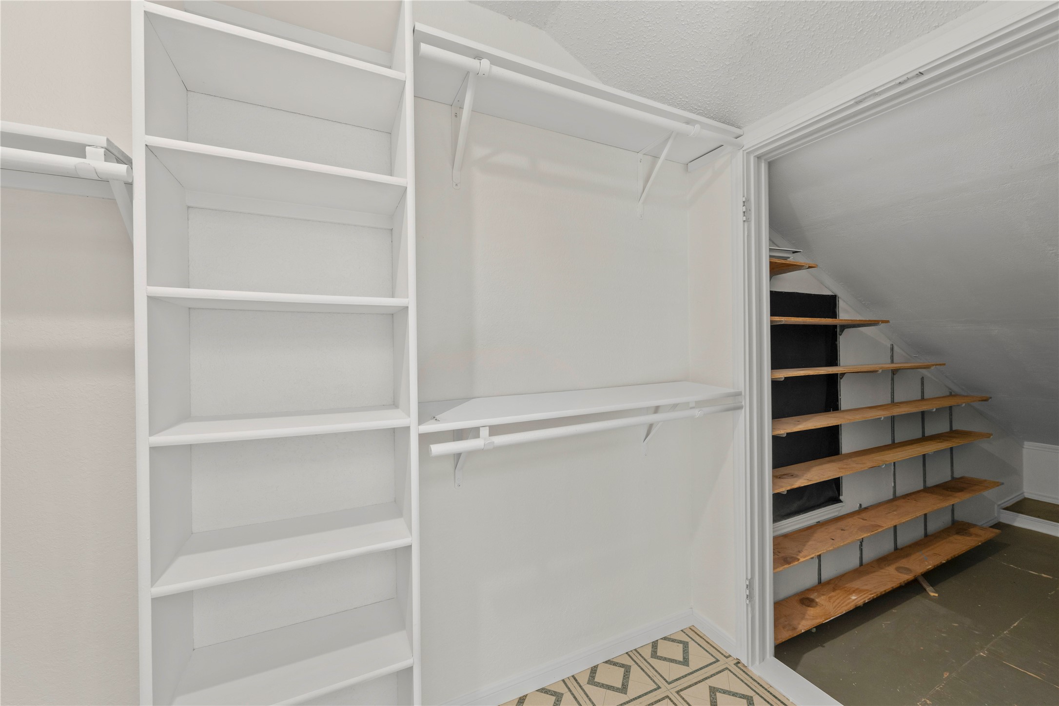 986 Benchmark Trail Belton, TX 76513 - Photo 19 of 31 a view of walk in closet with empty racks