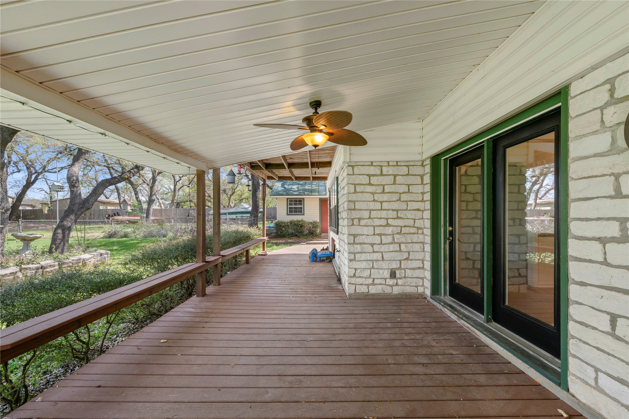 986 Benchmark Trail Belton, TX 76513 - Photo 26 of 31 a view of a porch with wooden floor and floor to ceiling window