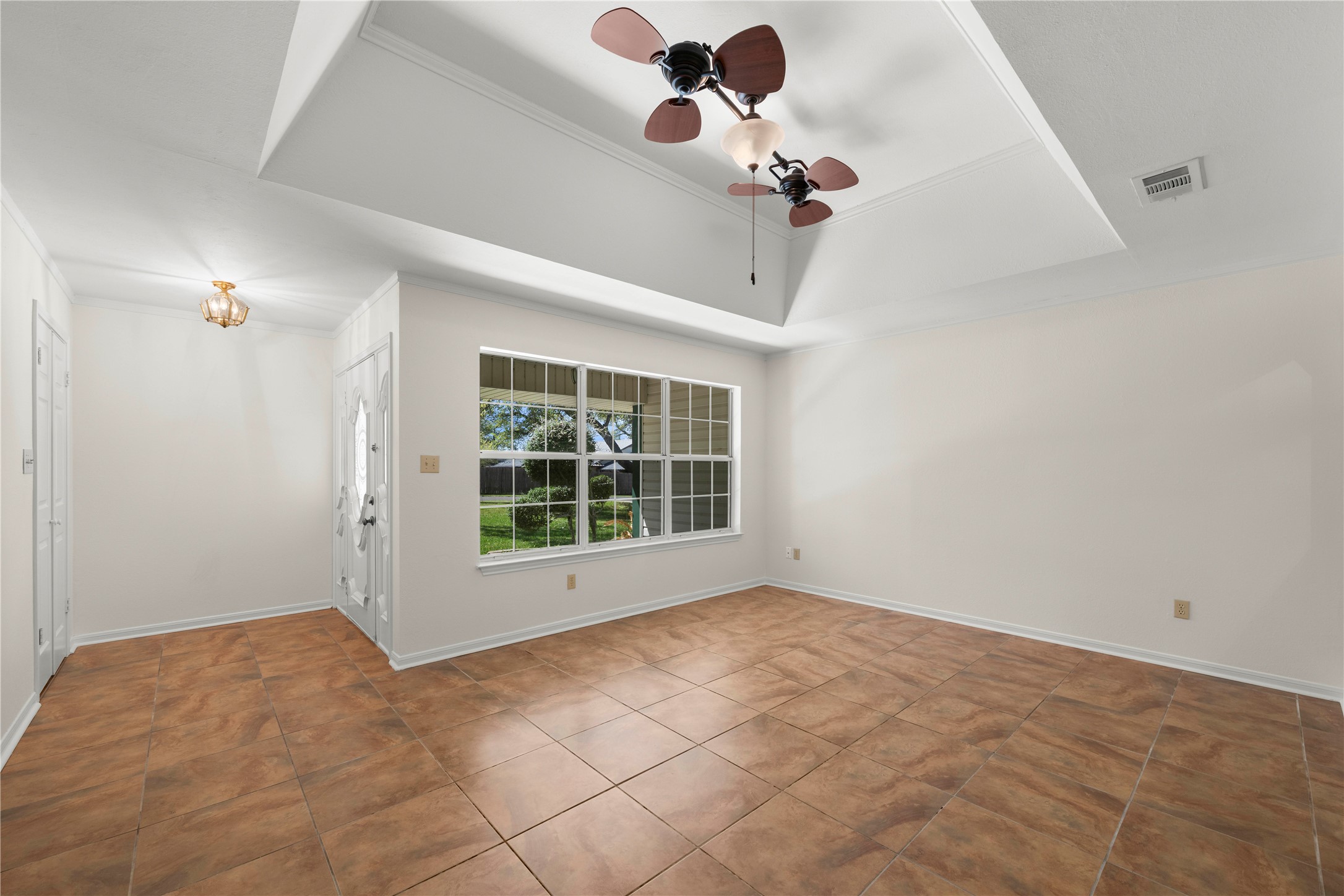986 Benchmark Trail Belton, TX 76513 - Photo 4 of 31 a view of an empty room with a window