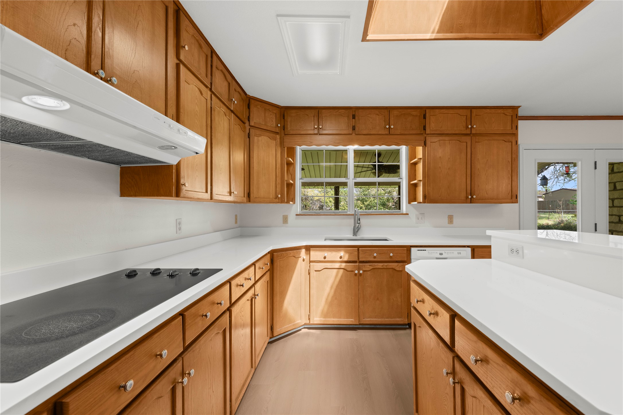 986 Benchmark Trail Belton, TX 76513 - Photo 8 of 31 a kitchen with a sink cabinets and window