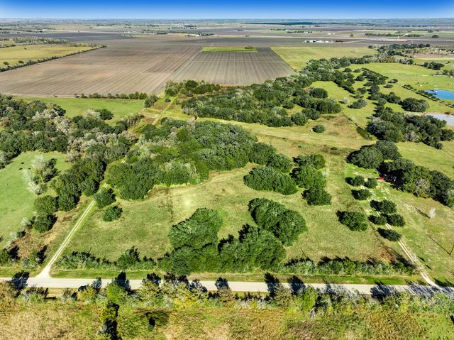 a backyard of a house with outdoor seating