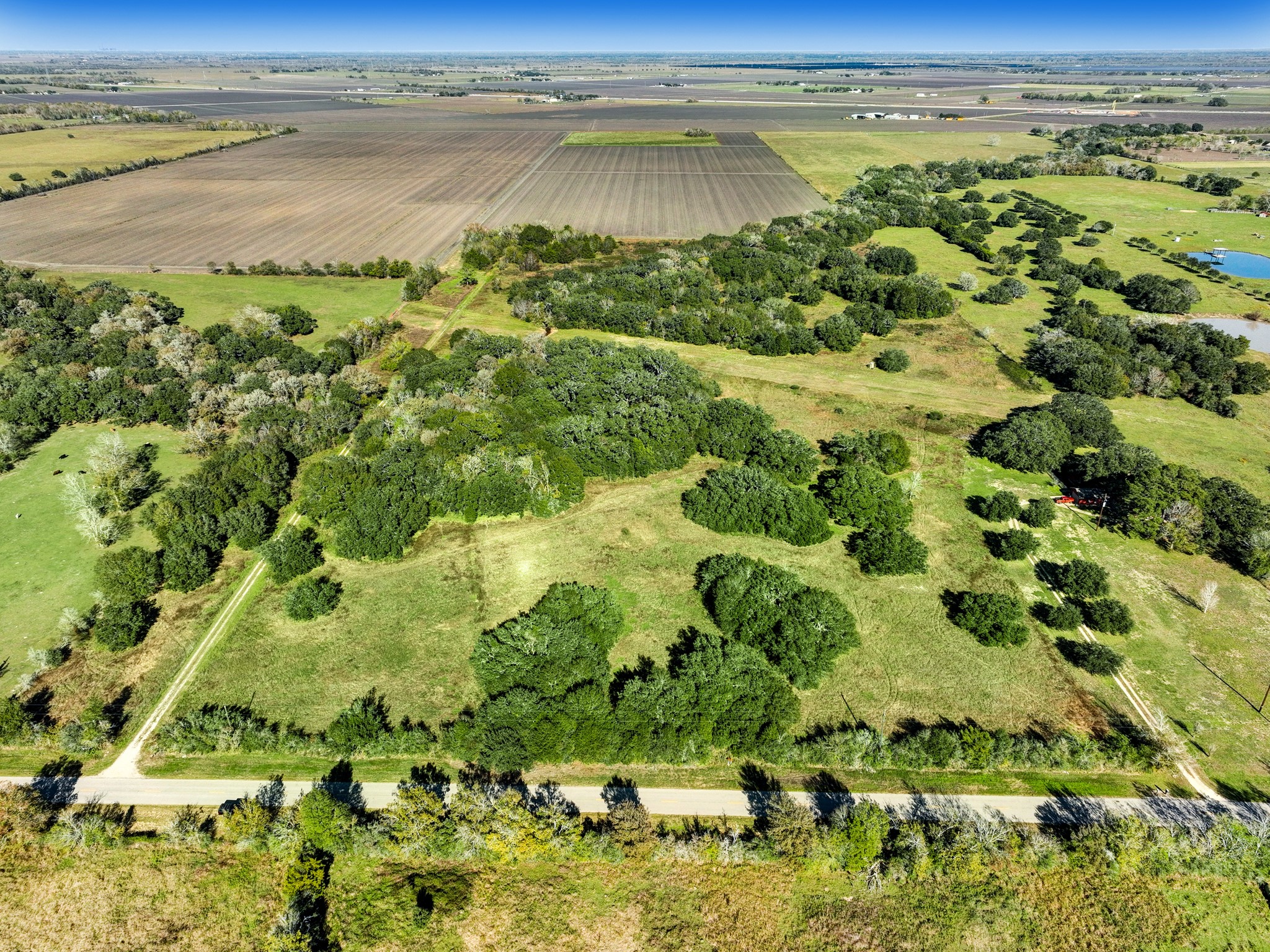 0 County Road 509 Road Damon, TX 77430 - Photo 12 of 18 a view of a lake with a lake