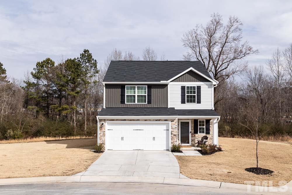201 Rustling Way Zebulon, NC 27597 - Photo 2 of 30 a front view of a house with a yard