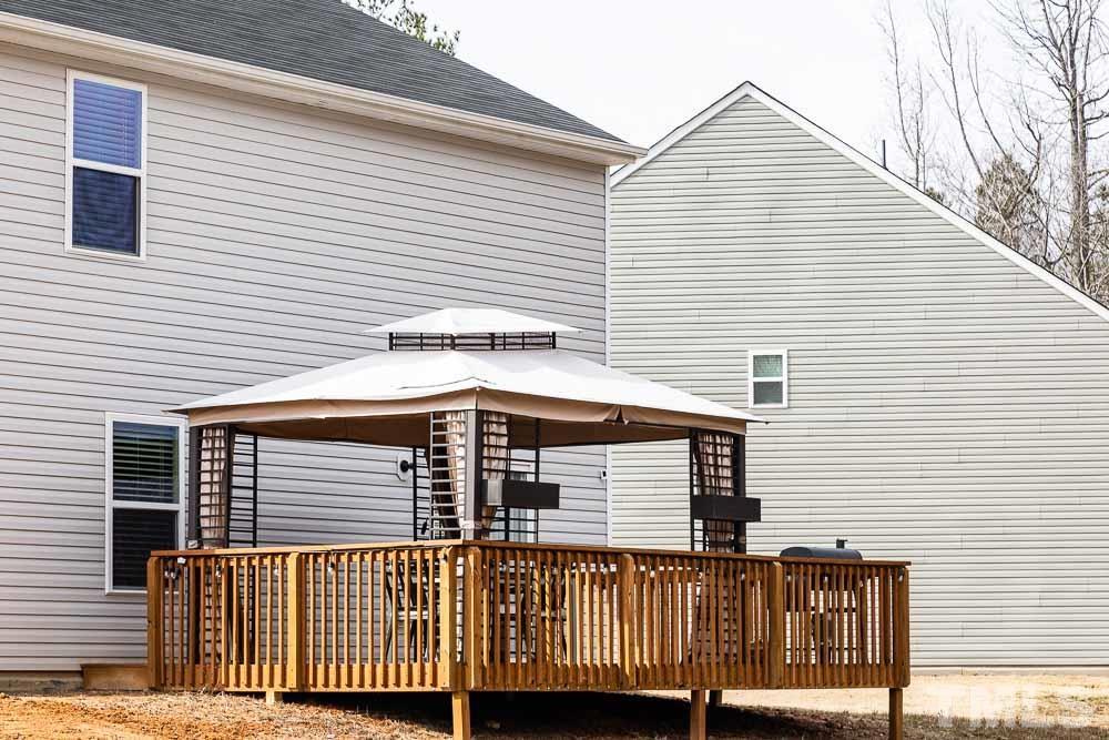 201 Rustling Way Zebulon, NC 27597 - Photo 25 of 30 a view of a house with wooden fence
